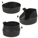 Black plastic camping bowls and cups designed for outdoor use, part of a portable dining set for camping and hiking.