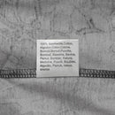 Close-up of a fabric label on a gray MFH U.S. military style flecktarn t-shirt showing 100% cotton material in multiple languages.