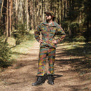 Man wearing original Belgian army M90 jigsaw camouflage military combat field pants and jacket in forest.
