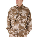 Man wearing original British army desert camouflage field jacket shirt with buttoned chest pockets and collar