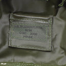 Close-up of label inside an original Danish military flask pouch with M84 camouflage and model information.