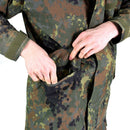 Close-up of hands opening a pocket on a German army Flecktarn camouflage Gore-Tex waterproof parka jacket