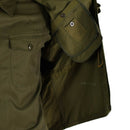 Close-up of the olive green original vintage Czech M85 army field jacket showing pockets and button-up cuff detail.
