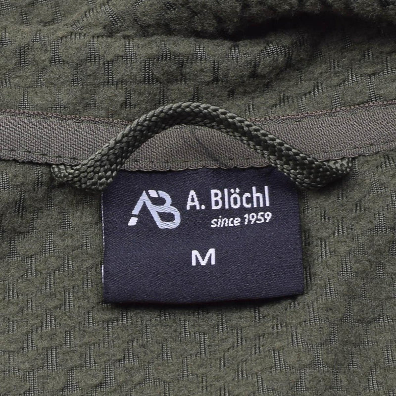 Close-up of the A. Blochl brand label on an olive military-style fleece thermal jacket size medium