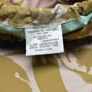 Close-up of size label on British army desert camouflage waterproof combat trousers for wet weather use