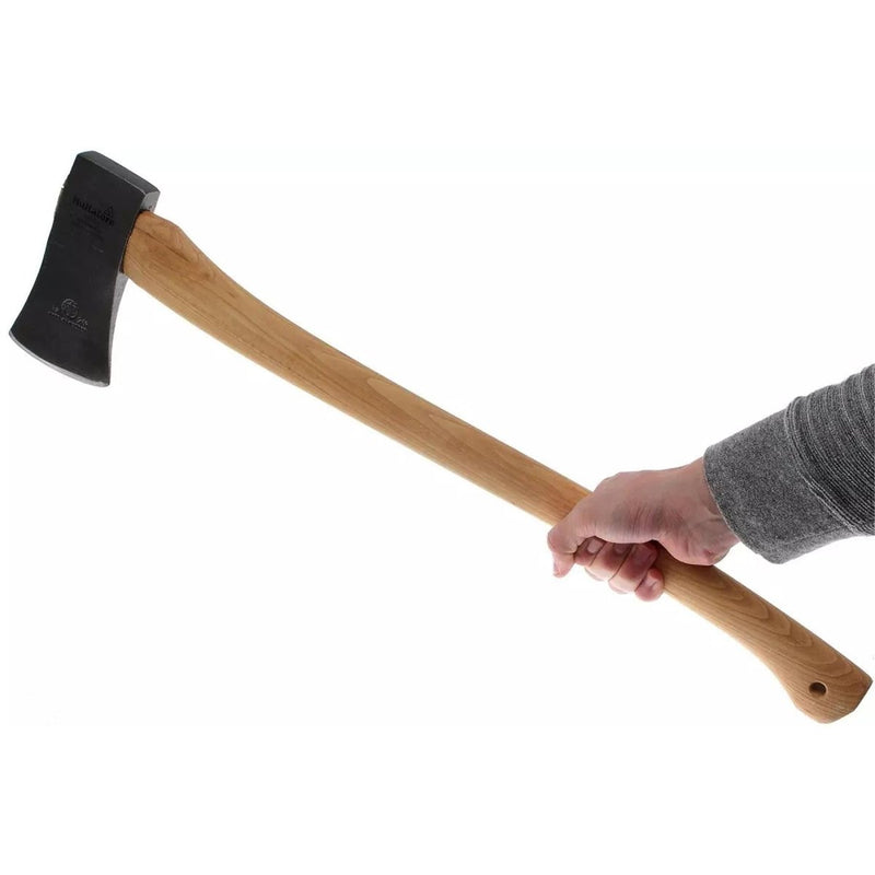 Hand holding Hultafors HY 10-1.2 SV felling axe with carbon steel head and durable hickory wood handle