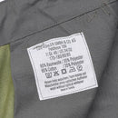 Close-up of Leo Kohler BDU pants care label showing material, size, and washing instructions in German and English