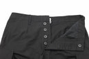 Close-up of black prewashed moleskin Mil-Tec German Army style Bermuda shorts with button fly and pockets visible