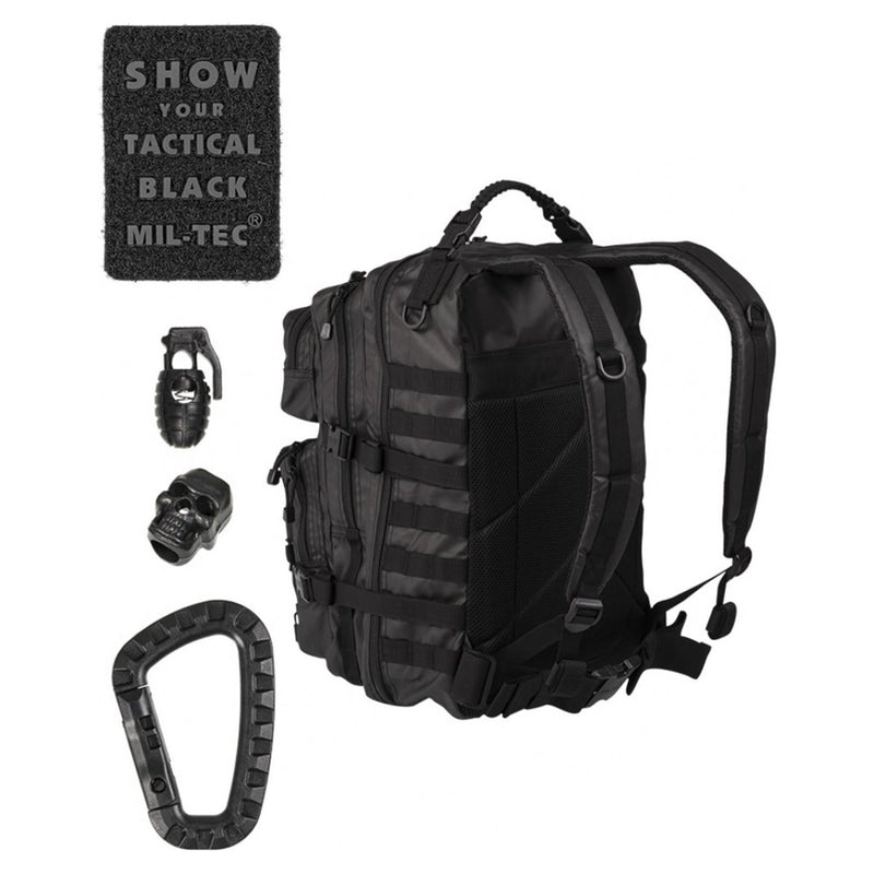 Black MIL-TEC U.S. Assault Ranger tactical backpack with PVC coating, patch, grenade keychain, skull accessory, and carabiner clip.