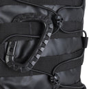 Close-up of black MIL-TEC U.S. Assault tactical backpack showing straps, bungee cords, and skull-shaped cord locks