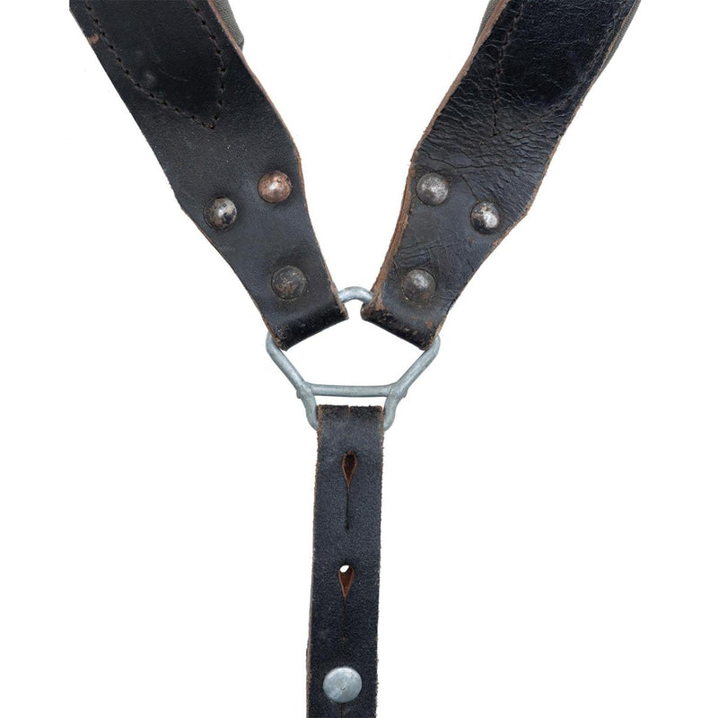 Close-up of original Austrian Army Y-Strap braces made from black genuine leather with metal rivets and triangular metal ring.