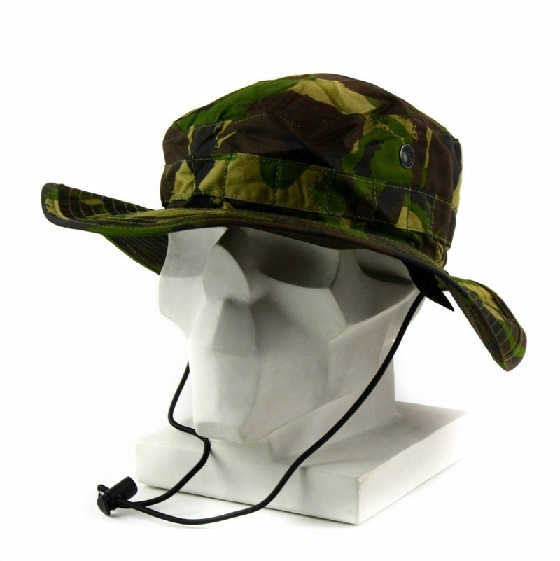 British Army boonie cap in woodland camo with vent holes and chin strap for sun protection and comfort.