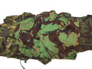 Original British army BDU combat smock in woodland camo with multiple pockets and adjustable fit for cold weather use.