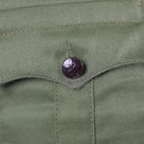 Close-up of a black star-embossed button on the original Bulgarian army green olive military jacket pocket flap