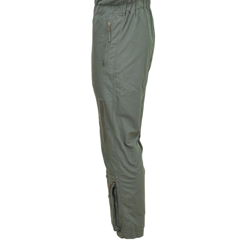 Side view of olive-green flame-resistant aramid cargo bib pants with zipper and adjustable ankle closures