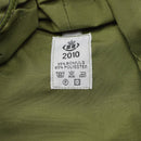 Close-up of green fabric label showing 2010, 35% bomuld 65% polyester, and care symbols on Danish M84 bucket hat