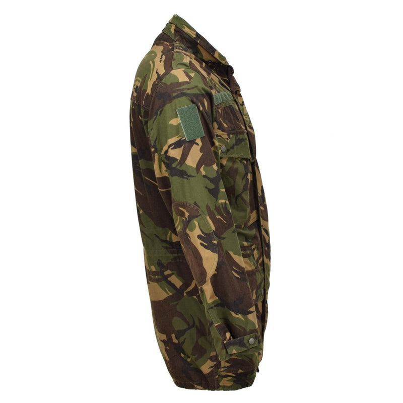 Side view of original Dutch army M65 waterproof military parka with camouflage pattern and rugged design