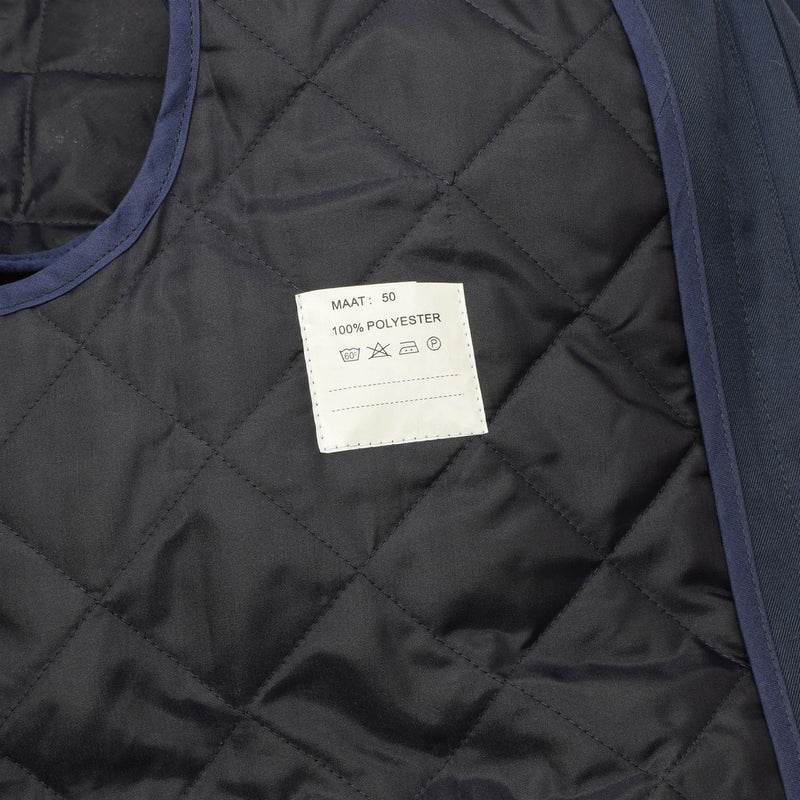 Quilted polyester liner inside Original Dutch Military blue trench raincoat size 50 for warmth and durability.