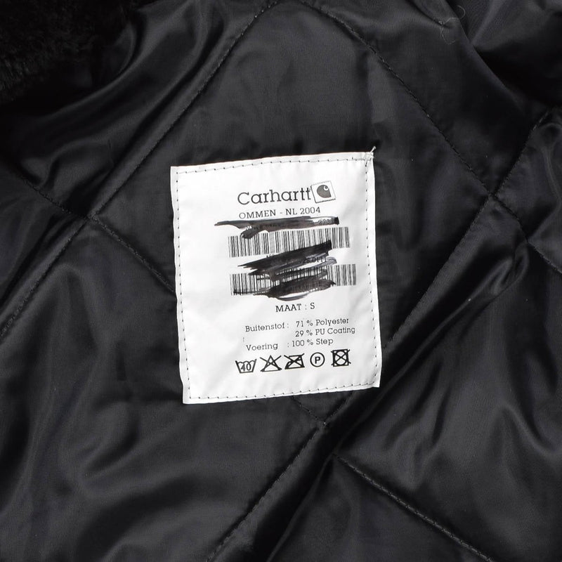 Close-up of quilted black liner with Carhartt label inside Dutch military work coverall jumpsuit