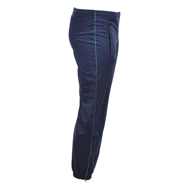 Side view of original French Army navy blue training tracksuit pants with green piping and zippered pocket.