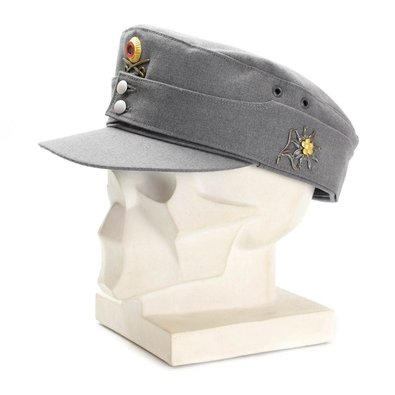 Original German Army Gebirgsjäger mountain cap in grey with floral badge and neck flap displayed on a mannequin head.