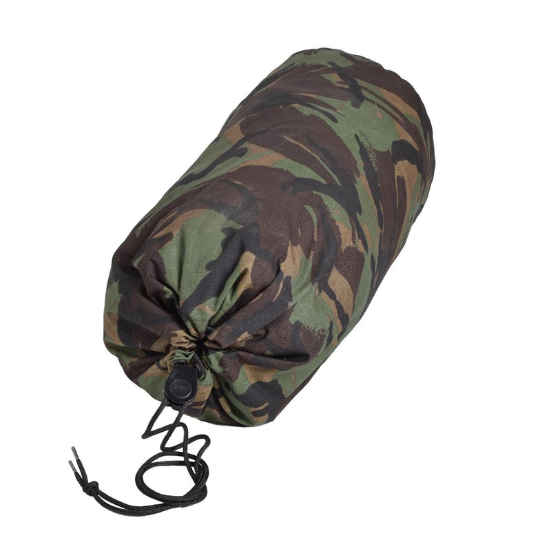 Waterproof military camo compression storage bag with drawstring closure for camping and outdoor gear protection.