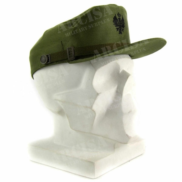 Olive green Spanish military visor cap with emblem and chin strap displayed on white mannequin head side view