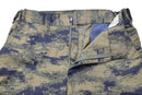 Close-up of original Turkish army blue digital camo tactical pants made from durable ripstop fabric with zipper and elastic waistband.