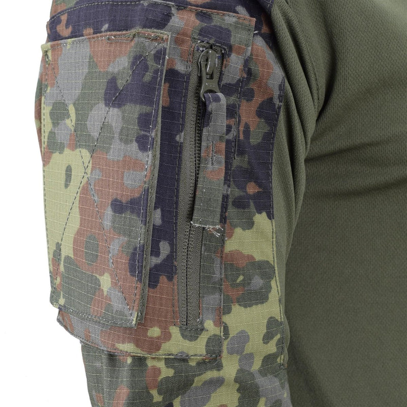 Close-up of TACGEAR Flecktarn camo combat shirt sleeve with ripstop fabric, zippered pocket, and green stretch torso fabric.