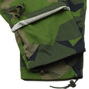 Close-up of TACGEAR Swedish Military style combat pants leg with splinter camo pattern and drawstring cord stopper
