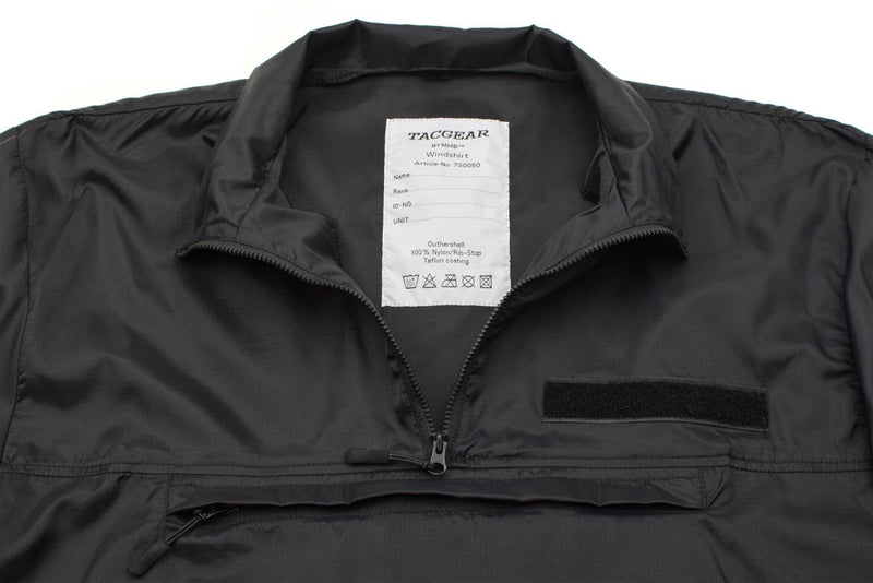 Close-up of TACGEAR black lightweight windproof hiking smock with YKK zipper and nylon ripstop fabric details