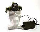 Headlight on a white bust with a power adapter on a white background